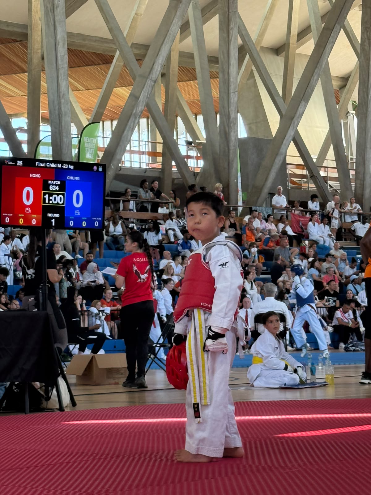 Young New Generation Taekwondo athlete waiting beside the competition ring
