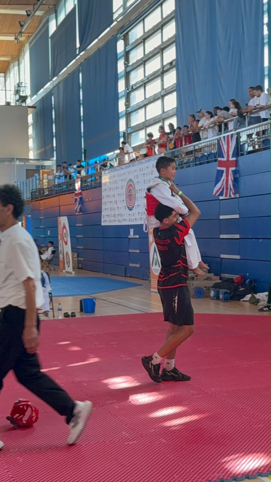 Young taekwondo athlete celebrating after a match